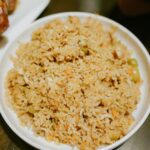 Mediterranean lemon rice in a bowl with cilantro and lemon zest