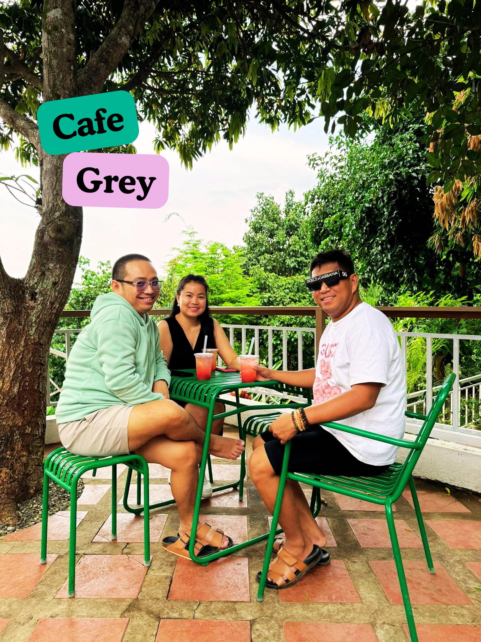 Three friends at Cafe Grey near Pililla Wind Farm in Rizal, relaxing under the trees with a view of the valley
