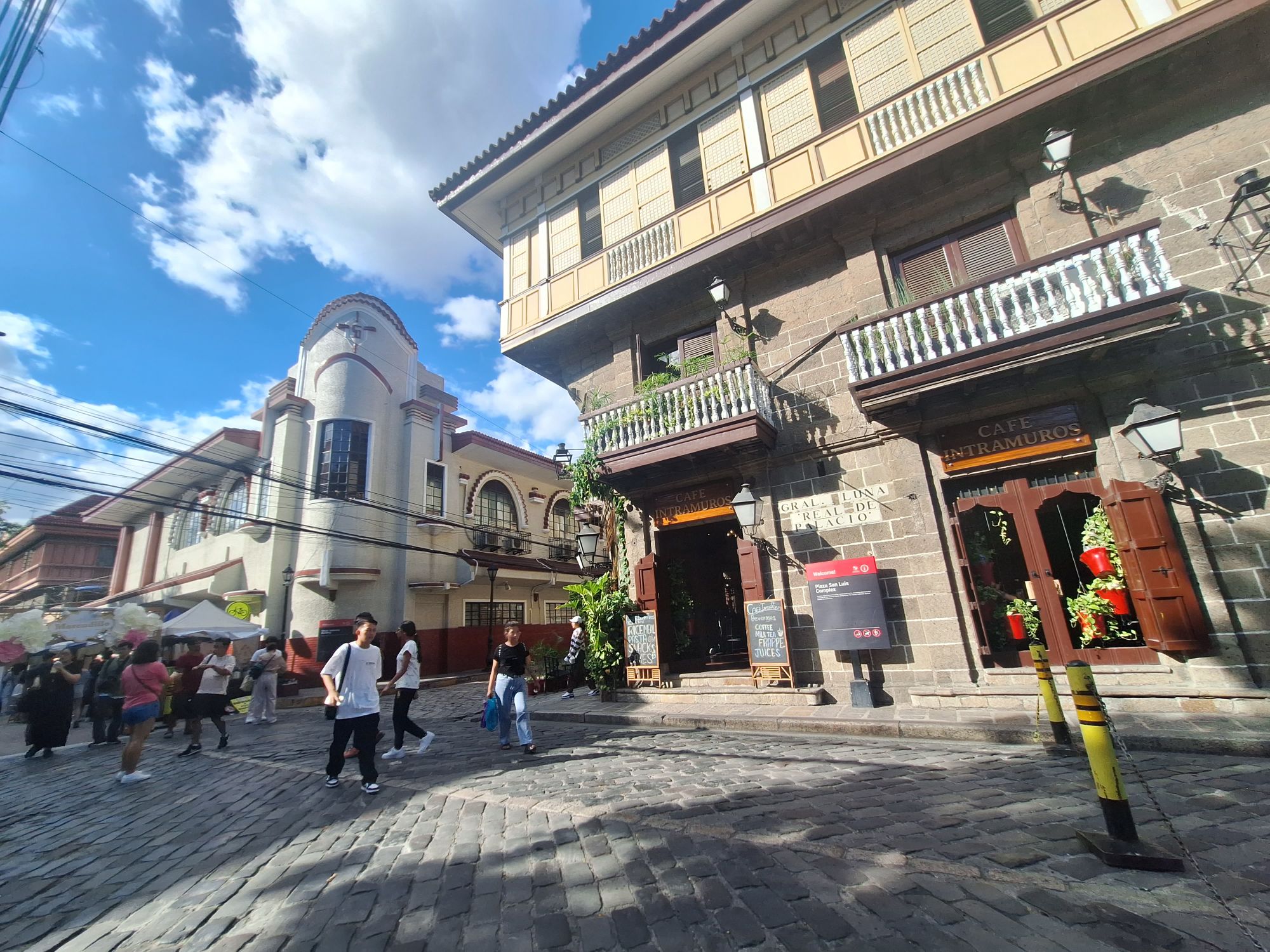 Cafe Intramuros in a heritage stone house along a cobblestone street in Intramuros, Manila
