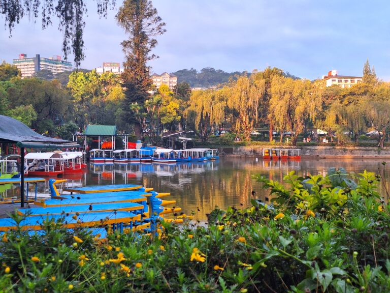 Colorful rental boats on Burnham Lake at Burnham Park in Baguio City on a sunny morning