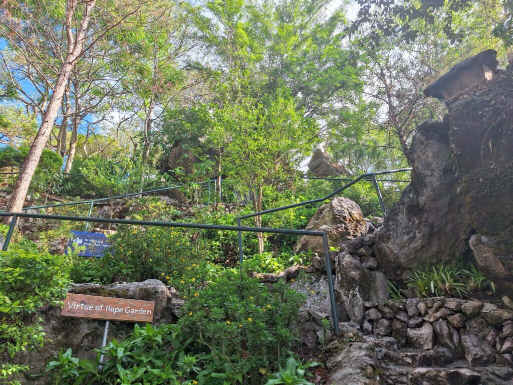 Rock formations and greenery along the trail at the Rock Gardens in Mirador Heritage and Eco-Spirituality Park, Baguio City