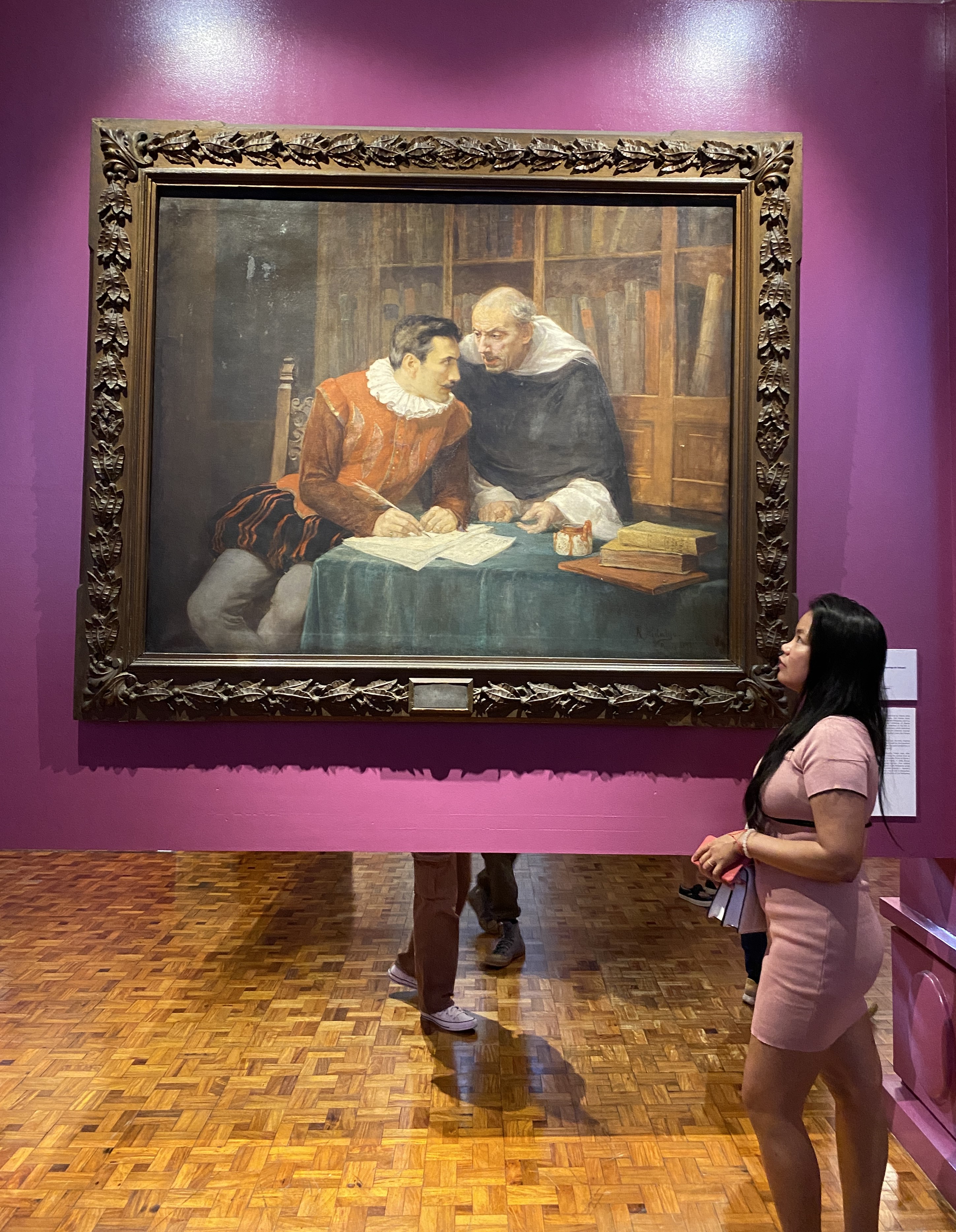 Jezelle viewing a large Spanish-era history painting at the National Museum of Fine Arts in Manila