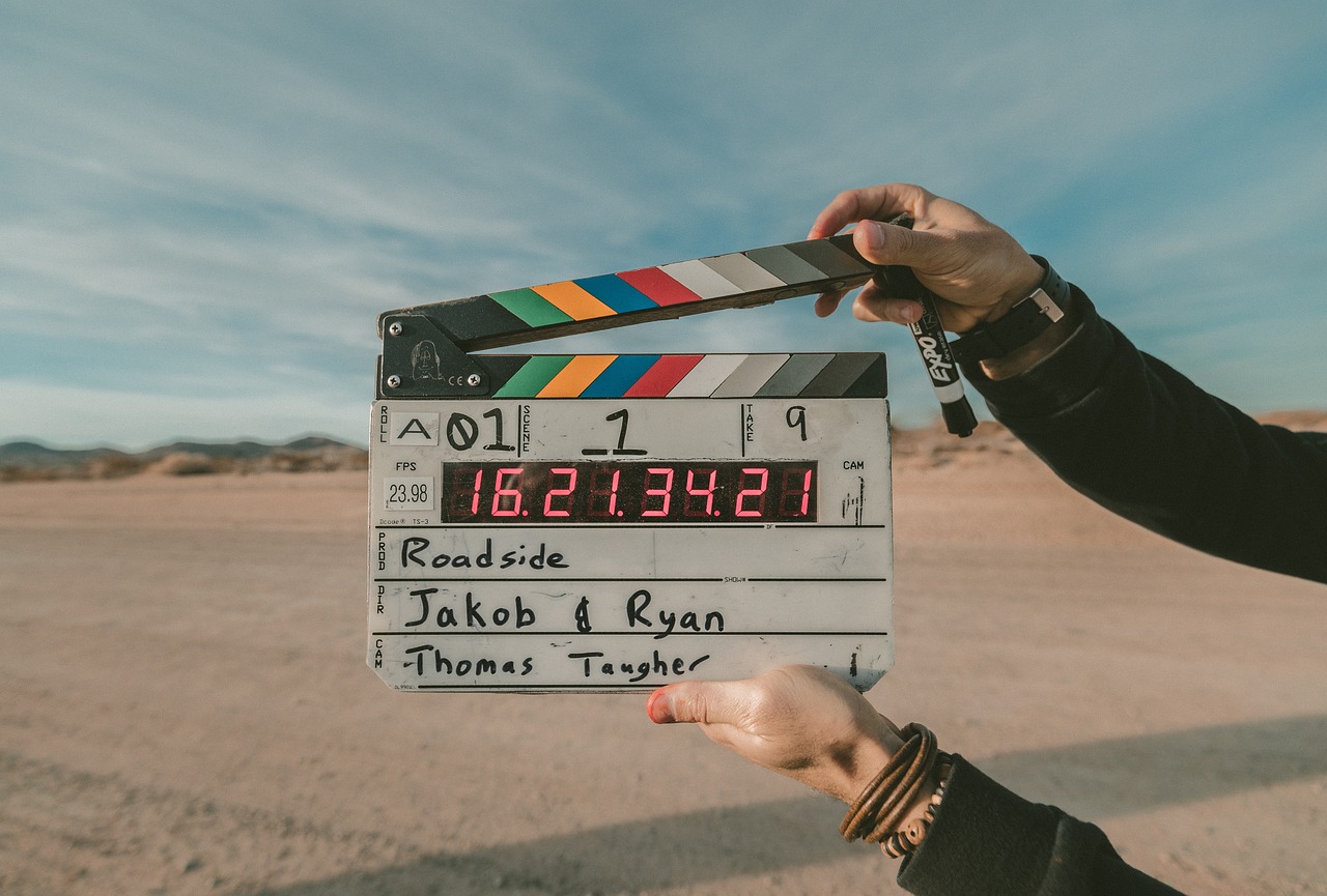 Book Adaptations - a film clapperboard held up on a movie set