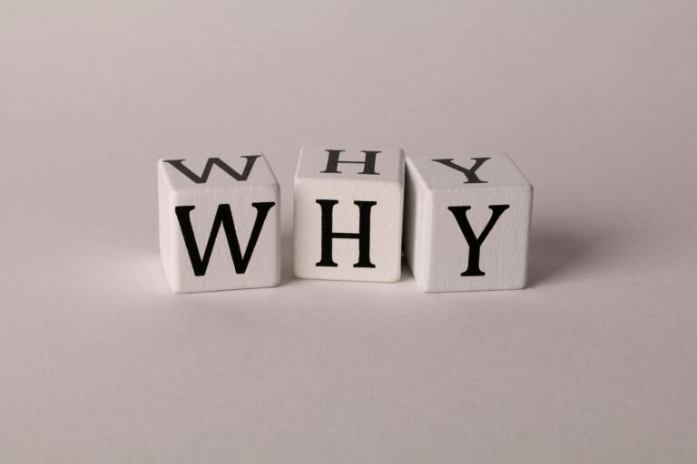 Start with Why by Simon Sinek — wooden blocks spelling WHY, a symbol of purpose-driven leadership