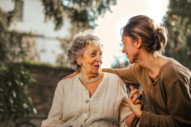 Good Morning Messages for a special parent-in-law: a joyful daughter greeting her happy senior mother in a garden