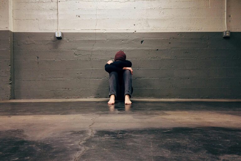 Feel the Fear and Do It Anyway – a person sitting alone, facing fear