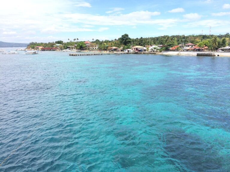 Cebu itinerary view of turquoise sea and a coastal village in Cebu, Philippines