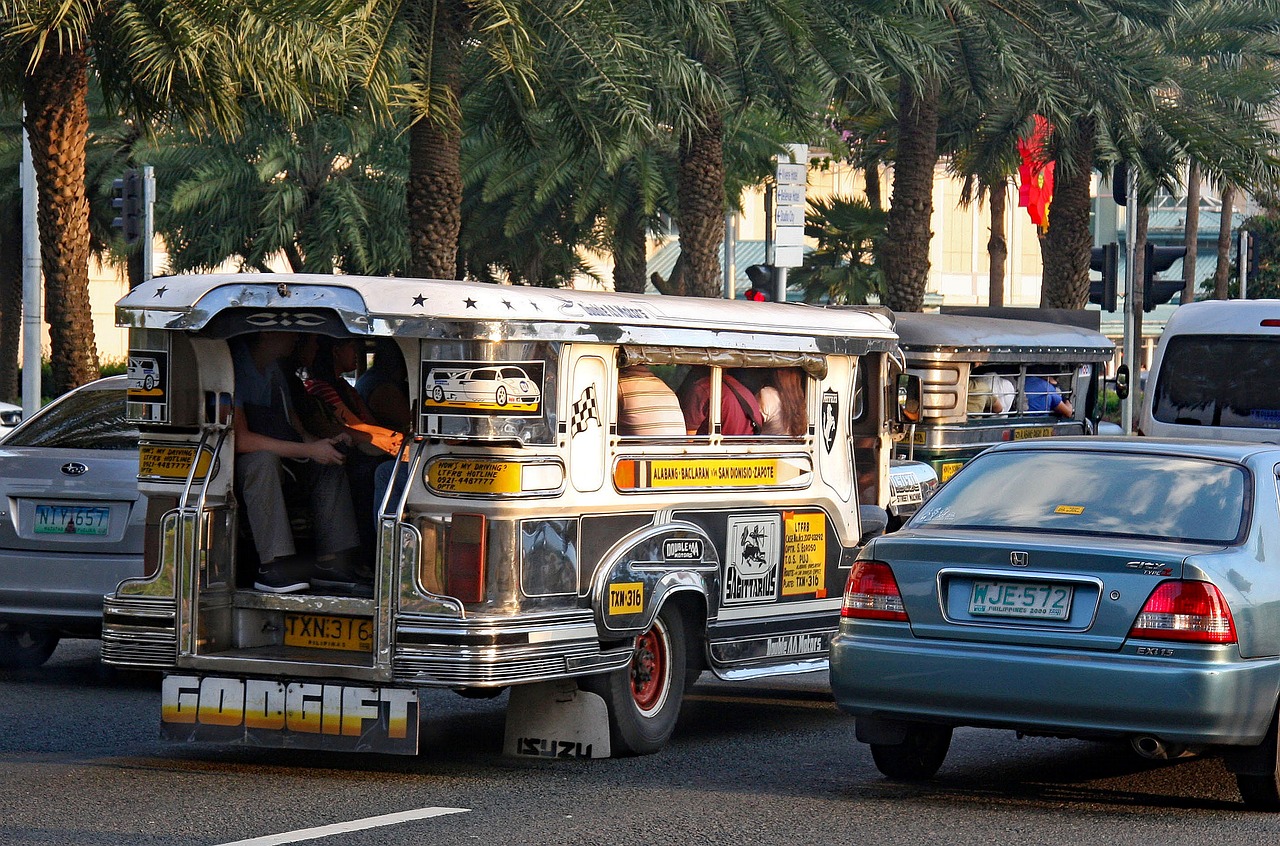 Ride-hailing apps Philippines - jeepney and cars in traffic in the Philippines